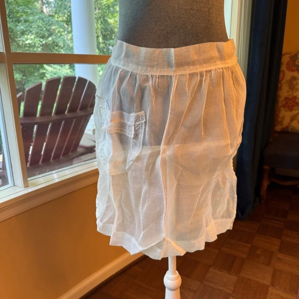 Vintage sheer chiffon or organdy half apron with lace trim and a single pocket